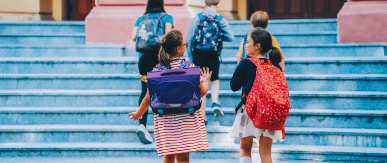 Photo of kids entering school building