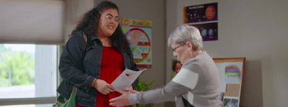 educator talking with student